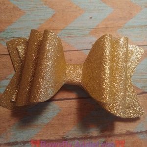 Little girl gold glitter bow